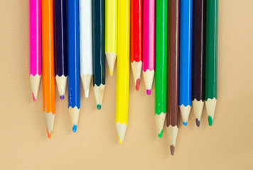 Lots of colorful pencils on a nice beige background