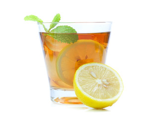 iced tea with lemon slices and mint on white background