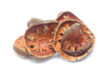 Dry bael fruit on white background