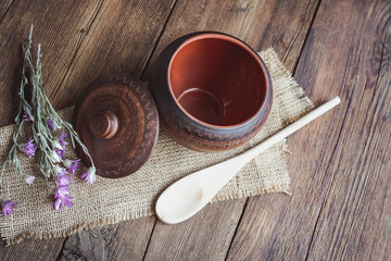clay dishes on a wooden old table.