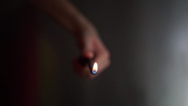 Handling a Gas Fire Starter Lighter (Front View)
