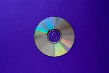 cd compact disc on  a dark blue background top view with copy space 