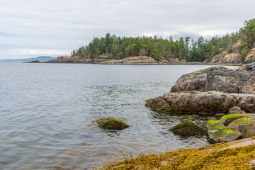 View over Inlet, ocean and island with mountains in beautiful British Columbia. Canada.