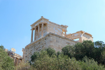 View to famous greek ancient landmark Propylaea of the Athenian Acropolis against a bright blue sky
