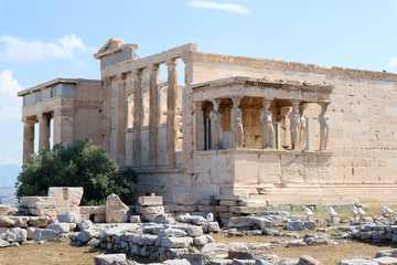 Fototapeta na wymiar View of the facade with caryatids of ancient Greek temple Erechtheion on the north side of the Athenian Acropolis in Athens Greece