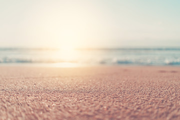Copy space of soft sand sea and blur tropical beach with sunset sky and cloud abstract background.