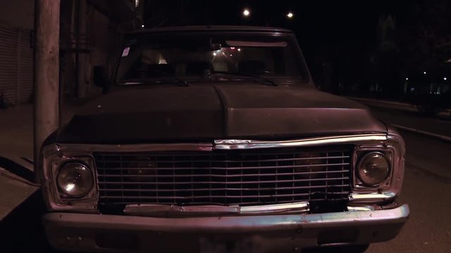 Old Vintage Car Parked at Night. 