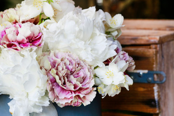 Detail of floral arrangement with white carnations.