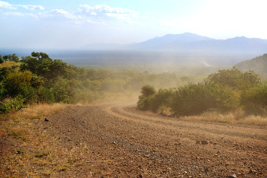 African landscape. Safari and extreme travel. Drought mountain landscape. Dust off road
