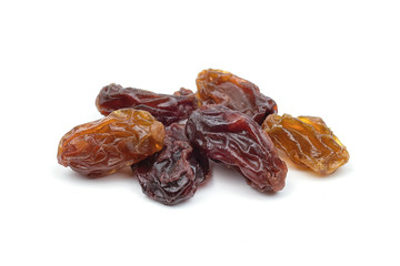 Dried raisins on white background.