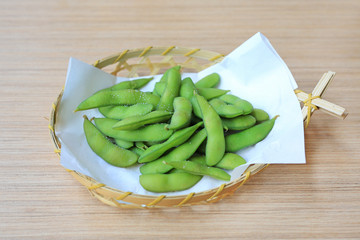 Edamame nibbles, boiled green soy beans, Japanese food