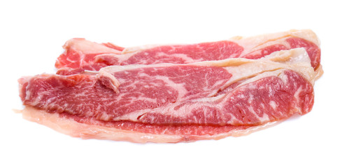 Fresh raw beef meat slices isolated over white background