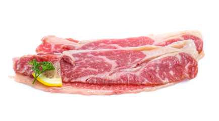Fototapeta premium Fresh raw beef meat slices isolated over white background