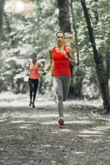 Fototapeta premium Young Women Jogging, Nature, Outdoors