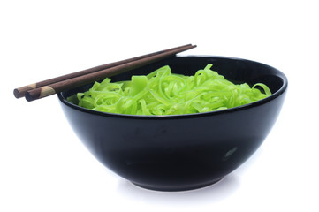 green noodles on bowl isolated on white background
