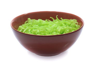 green noodles on bowl isolated on white background