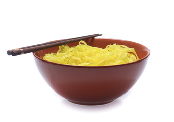 yellow noodles on bowl isolated on white background