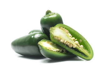 green chilies on white background (jalapeno)