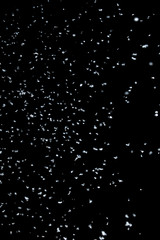 Texture of falling snow as a background or as a multiply overlay in photo editing
