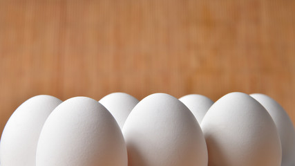 Chicken eggs on bamboo background