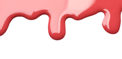 Colorful nail polish spilled on white background