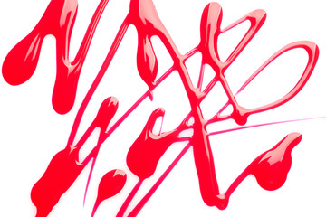 Drops of colorful nail polish on white background