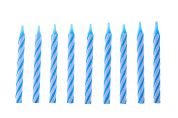 Blue striped birthday candles isolated on white