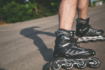 man with inline skates skating on the street