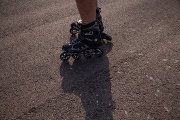 man with inline skates skating on the street