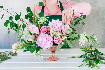 How to make modern table's centerpiece for summer wedding. A lot of greenery being composed into stunning arrangement