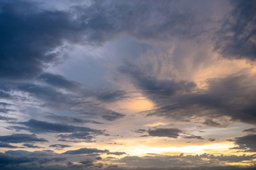 Naklejka na ściany i meble Beautiful clouds in the blue sky at sunset