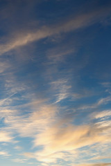 Naklejka na ściany i meble blue sky with clouds beautifully illuminated by the setting sun