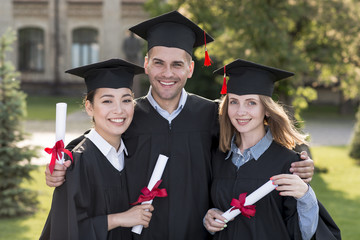 Portrait of group of students celebrating their graduation