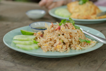 Close-up of delicious fried rice with blur omelette rice background.