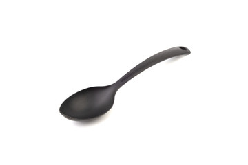 Black kitchen spoon utensils or kitchenware closeup isolated on white background