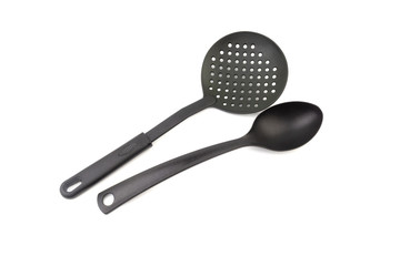 Black kitchen spatula and spoon utensils or kitchenware  closeup isolated on white background