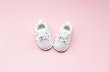 Children's  shoes for girls, stands on a pink background. closeup view from the top. the concept of children's clothing.