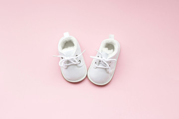 Children's  shoes for girls, stands on a pink background. closeup view from the top. the concept of...