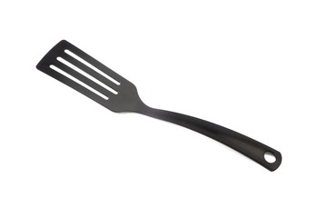 Black kitchen spatula utensils or kitchenware closeup isolated on white background