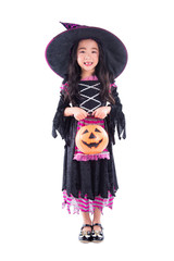 Full length of little asian girl wearing halloween costume and holding pumpkin basket and smiles  isolated over white background