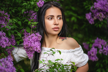 portrait of woman in blooming garden