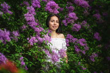 Beautiful spring girl in blooming tree