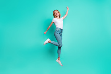 Full size photo of pretty lady raising hand arms smiling isolated over teal turquoise background