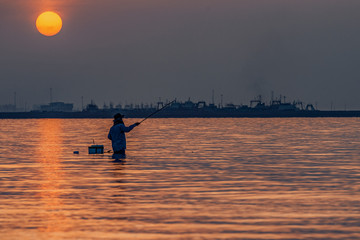 fisherman catches fish in the Persian Gulf waters of Bandar Abbas