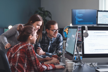 Team of programmers working in office