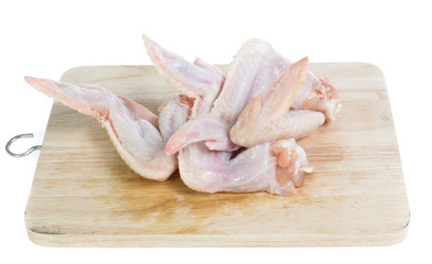 Raw chicken  on cutting board on white background