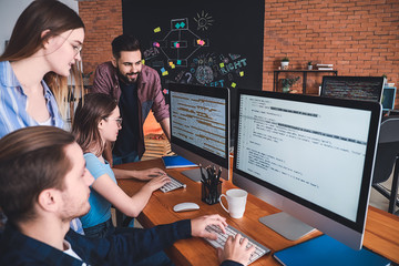 Team of programmers working in office