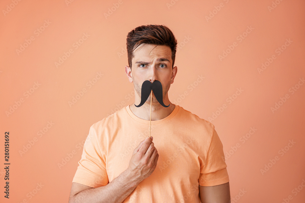 Sticker Funny portrait of handsome man with fake mustache on color background