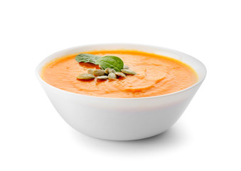 Bowl with delicious cream soup on white background