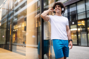 Fototapeta premium Happy sporty fit man running to stay healthy outdoor